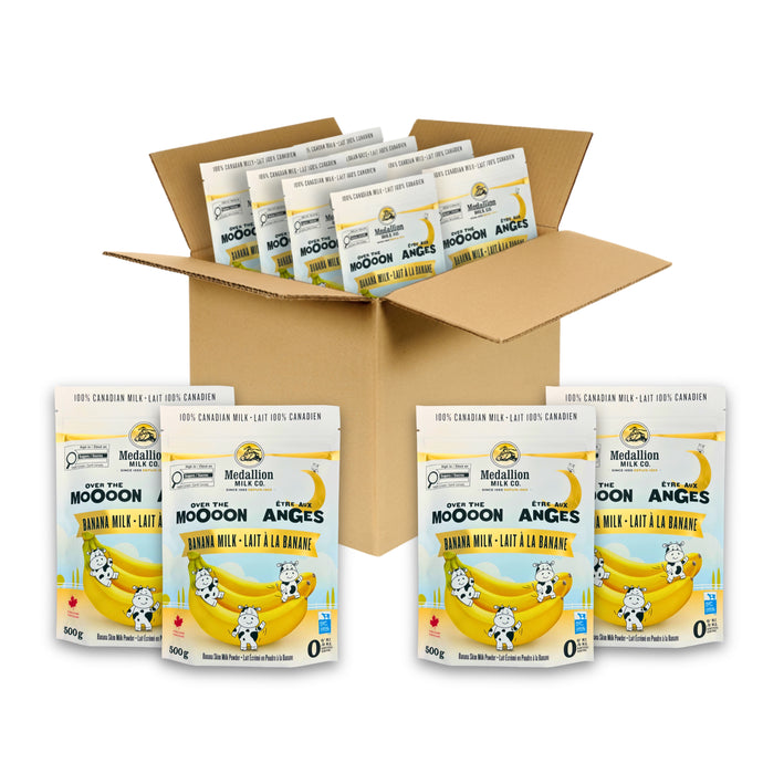 Case of twelve 500 g Medallion Milk Banana Milk Powder pouches displayed in an open cardboard box, with additional individual pouches shown in front.